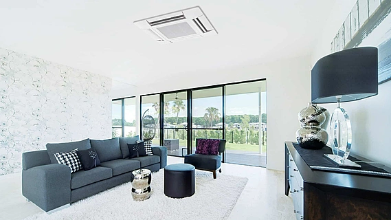 Bright, clean living room cooled by a quiet air conditioning system